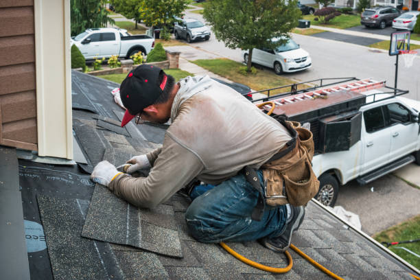 Professional Roofing technician working in Darien Center, NY